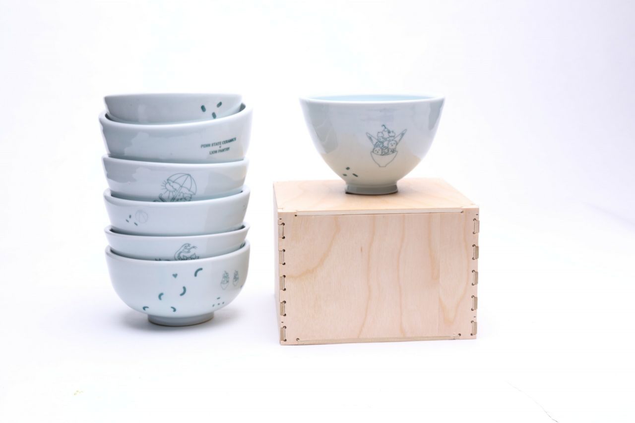 Stack of bowls and a bowl on a wooden box