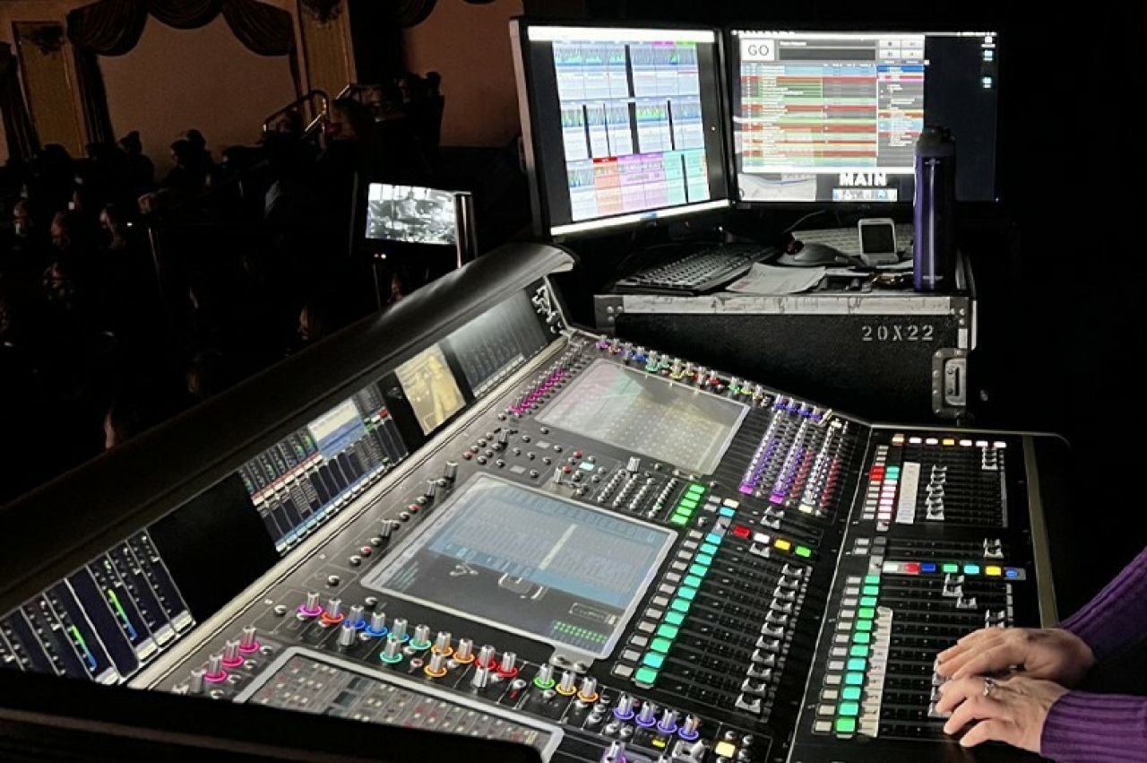 sound boars with hands on knobs
