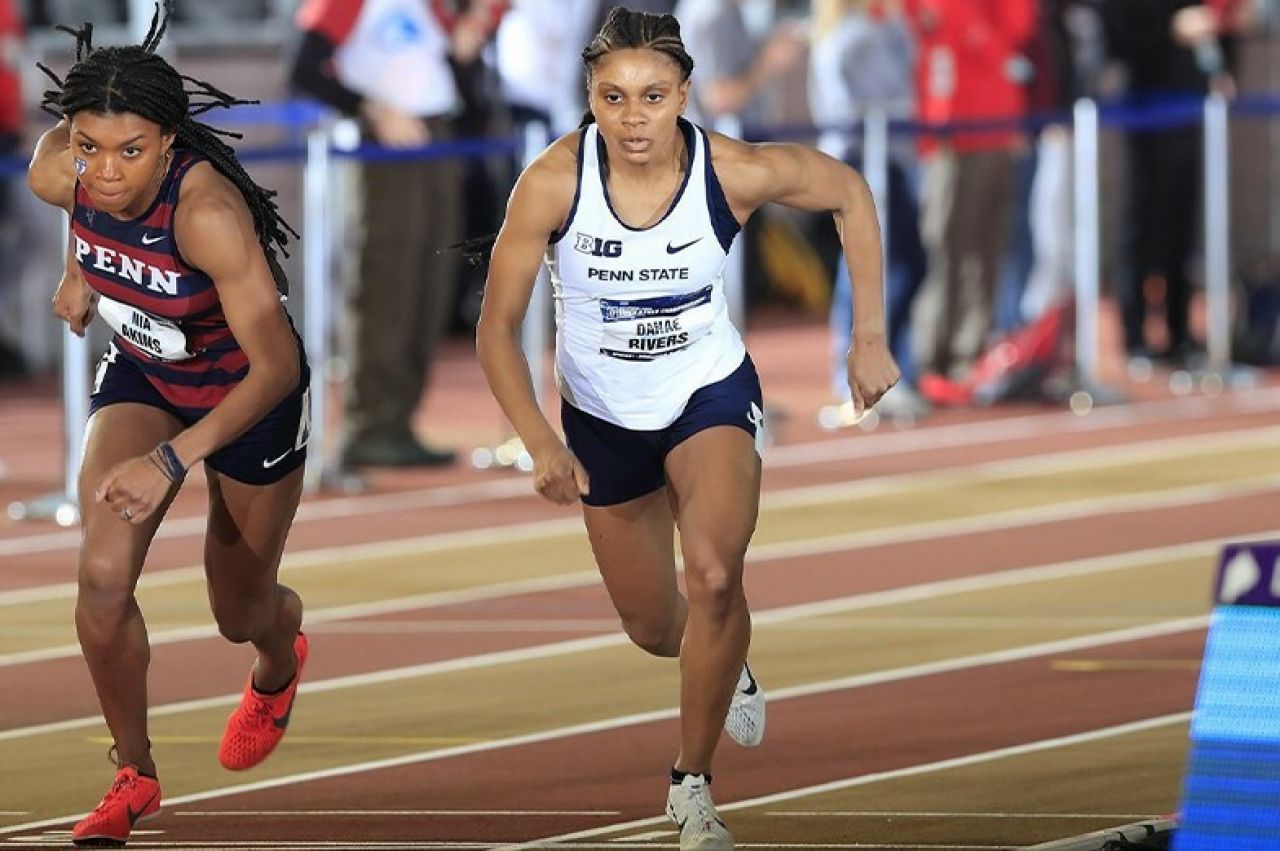 Danae Rivers running at a track and field event.