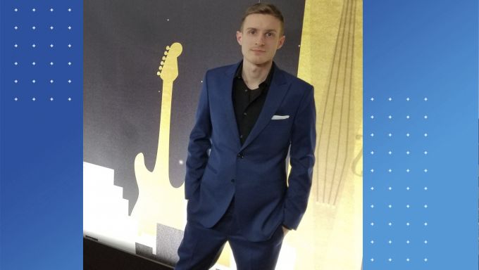 Image of a young man in a suit