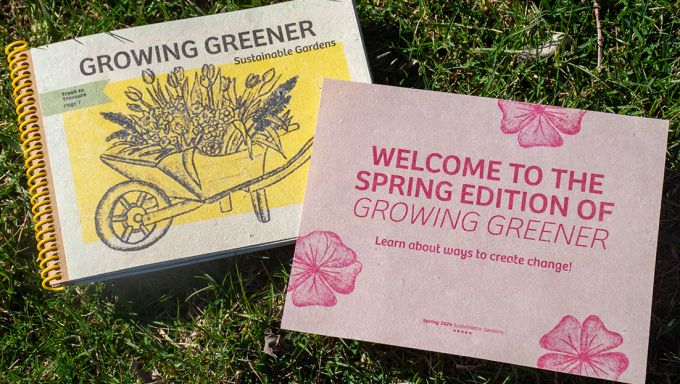 A publication called Growing Greener and a flyer promoting the publication atop grass.