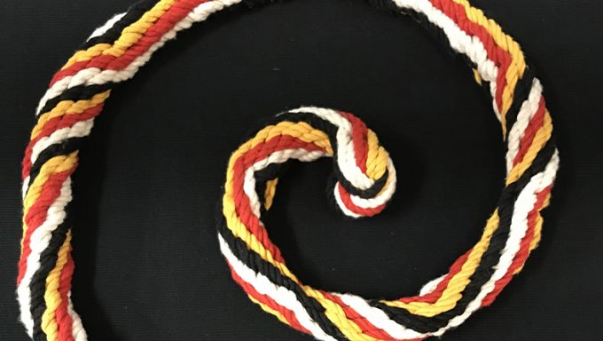 A spiral section of colorful rope braided using an ancient Incan technique