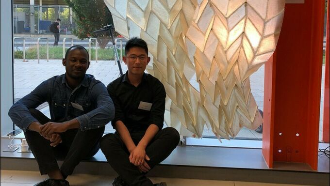 Jimi Demi-Ajayi and Julian Huang in front of their “Phototropic Origami Structure” project in London.