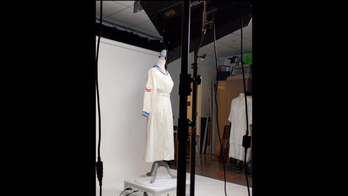 A linen nurse uniform (1910-30) on a turntable for 360-degree photography in Cody Goddard’s studio in the College of Arts and Architecture.