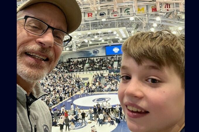 Dan Willis and his son attend a sporting event at Rec Hall.
