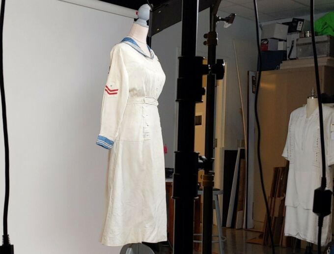 Nurse uniform from circa 1910 being photographed in a photo studio