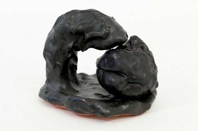 clay sculpture with black glaze
