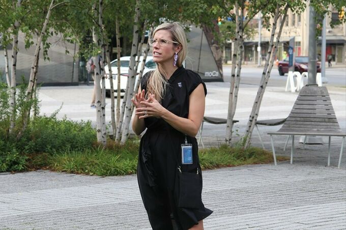 Megan Lykins-Reich addresses students outside the Museum of Contemporary Art in Cleveland.