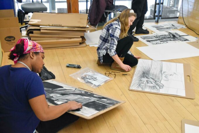 Students participating in a workshop exercise using charcoal during the workshops at Penn State. Image: Penn State