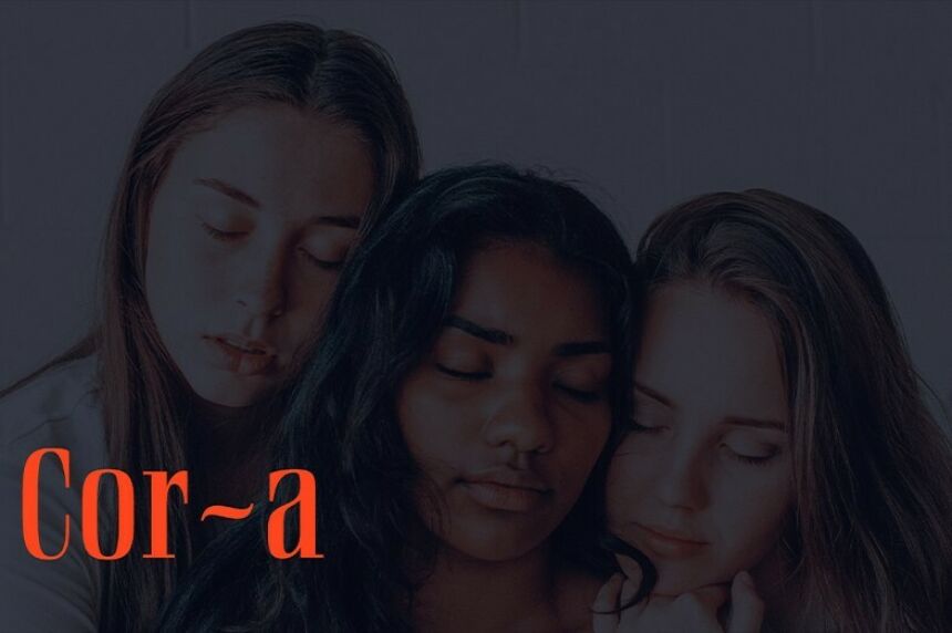 Dimmed image of three young women with one woman in the center being consoled by the others with red lettering that reads Cor-a