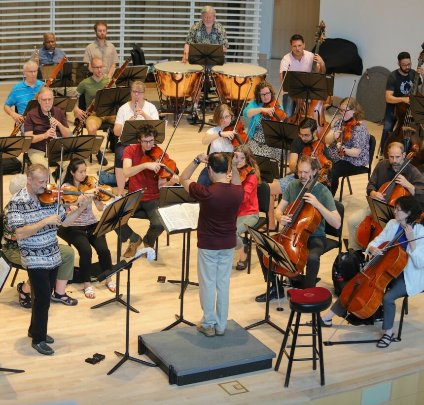 Members of the Penn's Woods Orchestra rehearse in the new music recital hall with soloist James Lyon.