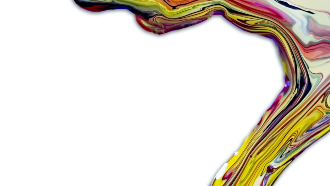 Close-up image of paint dripping with multiple colors