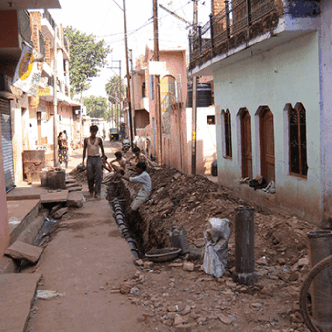 Villagers Laying sewer pipes in Indore, India.