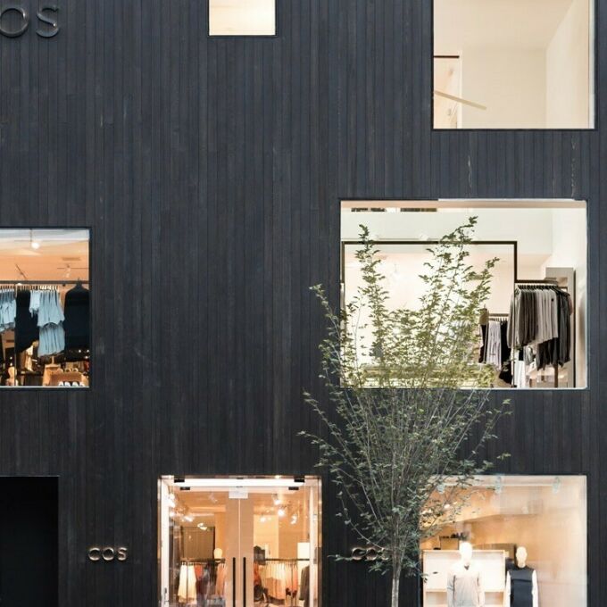 Modern, dark facade of high-end retail showroom for COS, in Toronto, Ontario. Architectural design by Samantha Josephat.