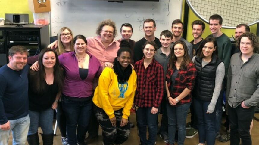 Current and former students meeting together in the Penn State Theatre Convergence Lab.