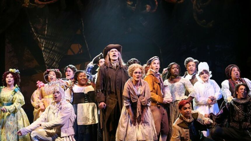 "Into the Woods" production photo with cast grouped in front of a darkened background at Ford's Theatre. Image credit: Carol Rosegg.