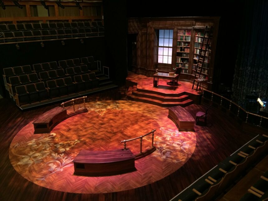 Overhead shot of "Daddy Long Legs" circular stage, with a prop library at the back.