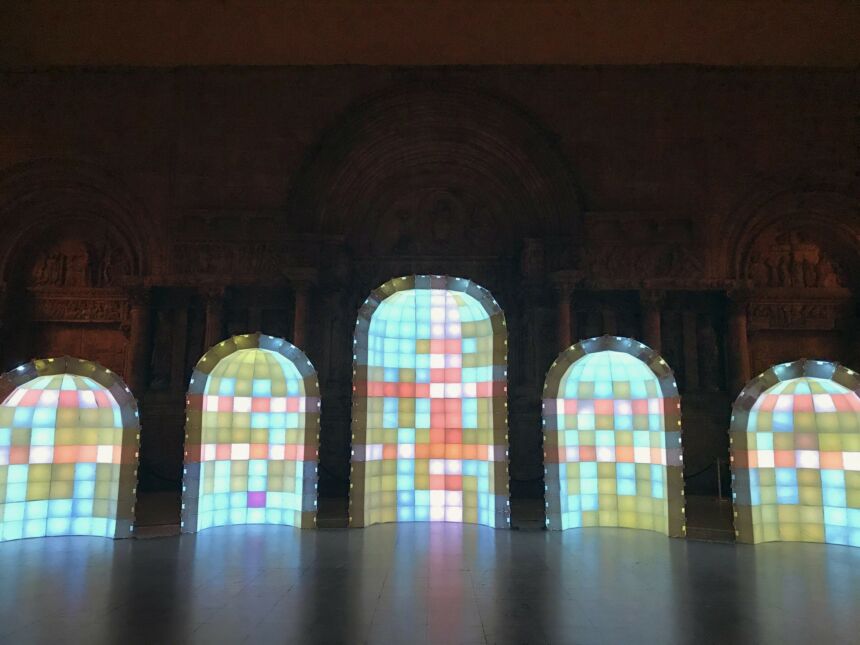 Interior shot of five rounded alcoves made from rainbow lightboxes, with the tallest one in the center.