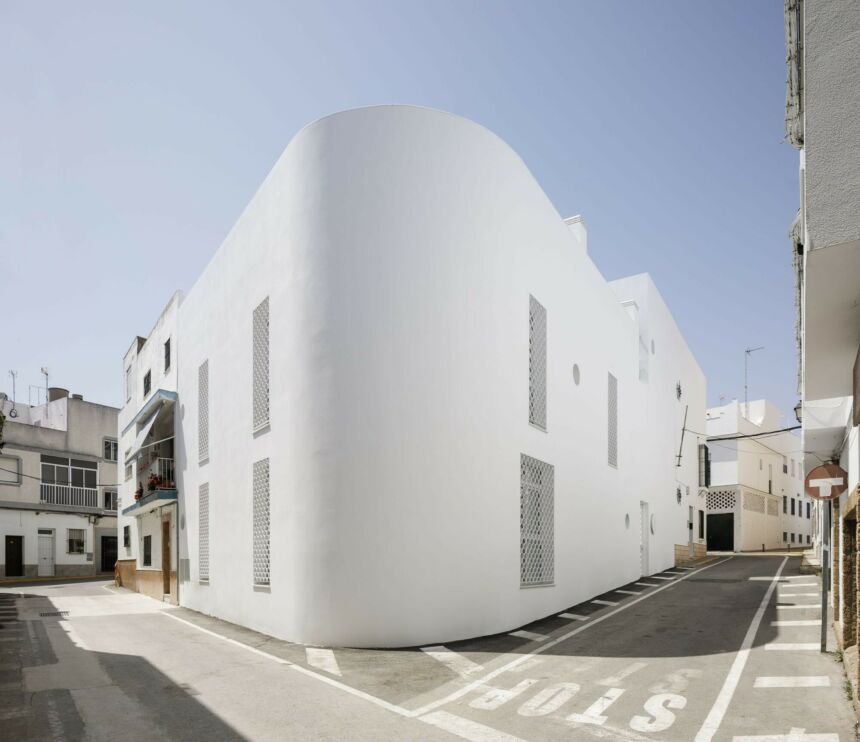 All white exterior view of a home suite in Spain.