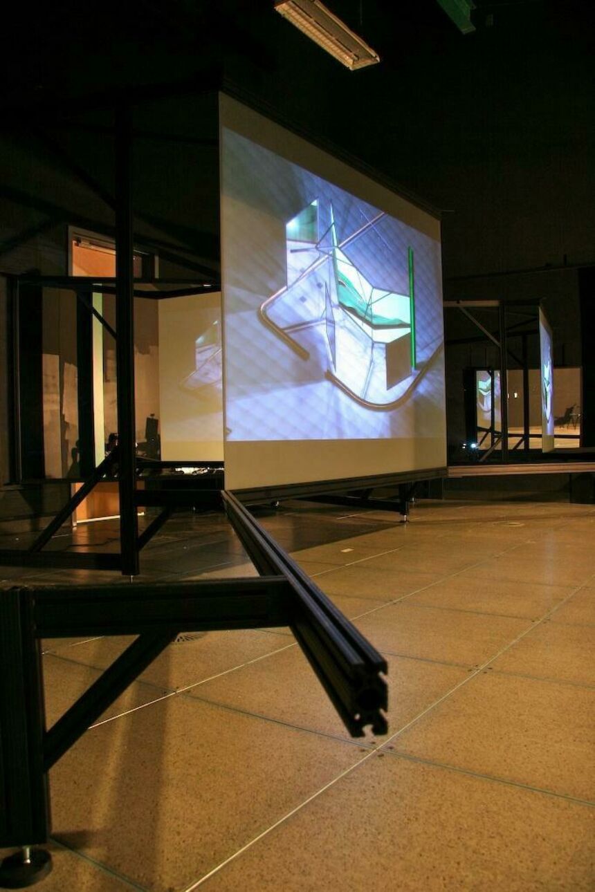 Photo of a computer-generated image projected on a large screen.