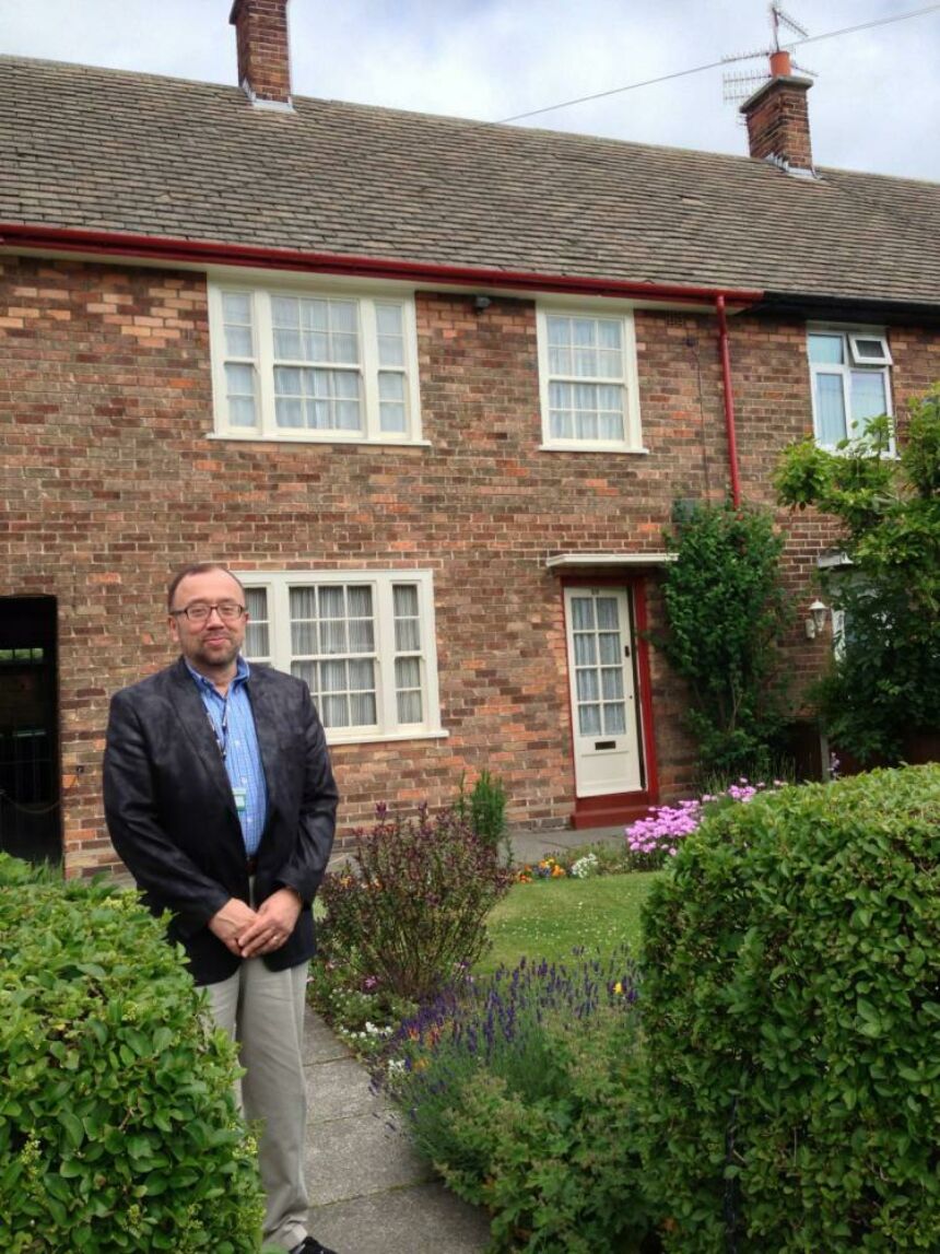 Photo of Vincent standing in front of Paul McCartney's childhood home.