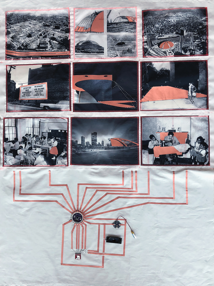 A white quilt with images of the Hill District in Pittsburgh in the 1960s with sensors embedded in the cloth.