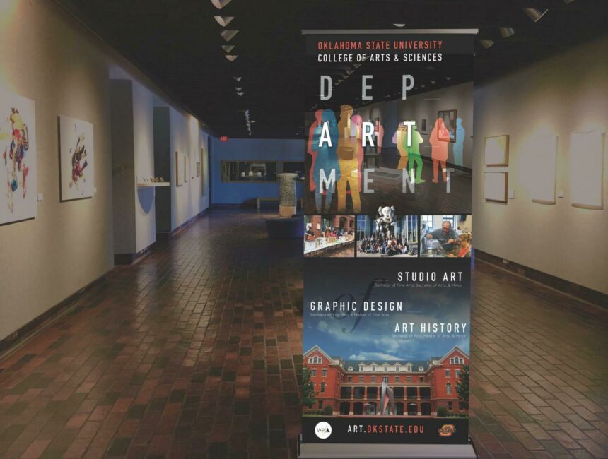 Photo of retractable floor banner featuring collage photo and artwork promoting Oklahoma State University's Art, Graphic Design, and Studio Arts department. The banner is sitting at the entrance to an art gallery.