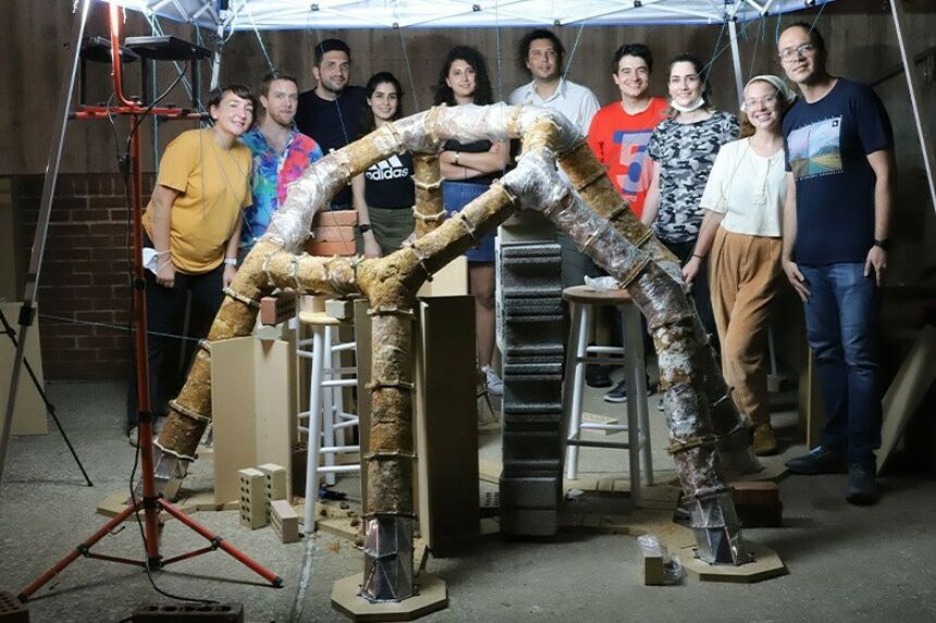 The ForMat Lab researchers involved in the MycoCreate project pose behind the first version of the installation.