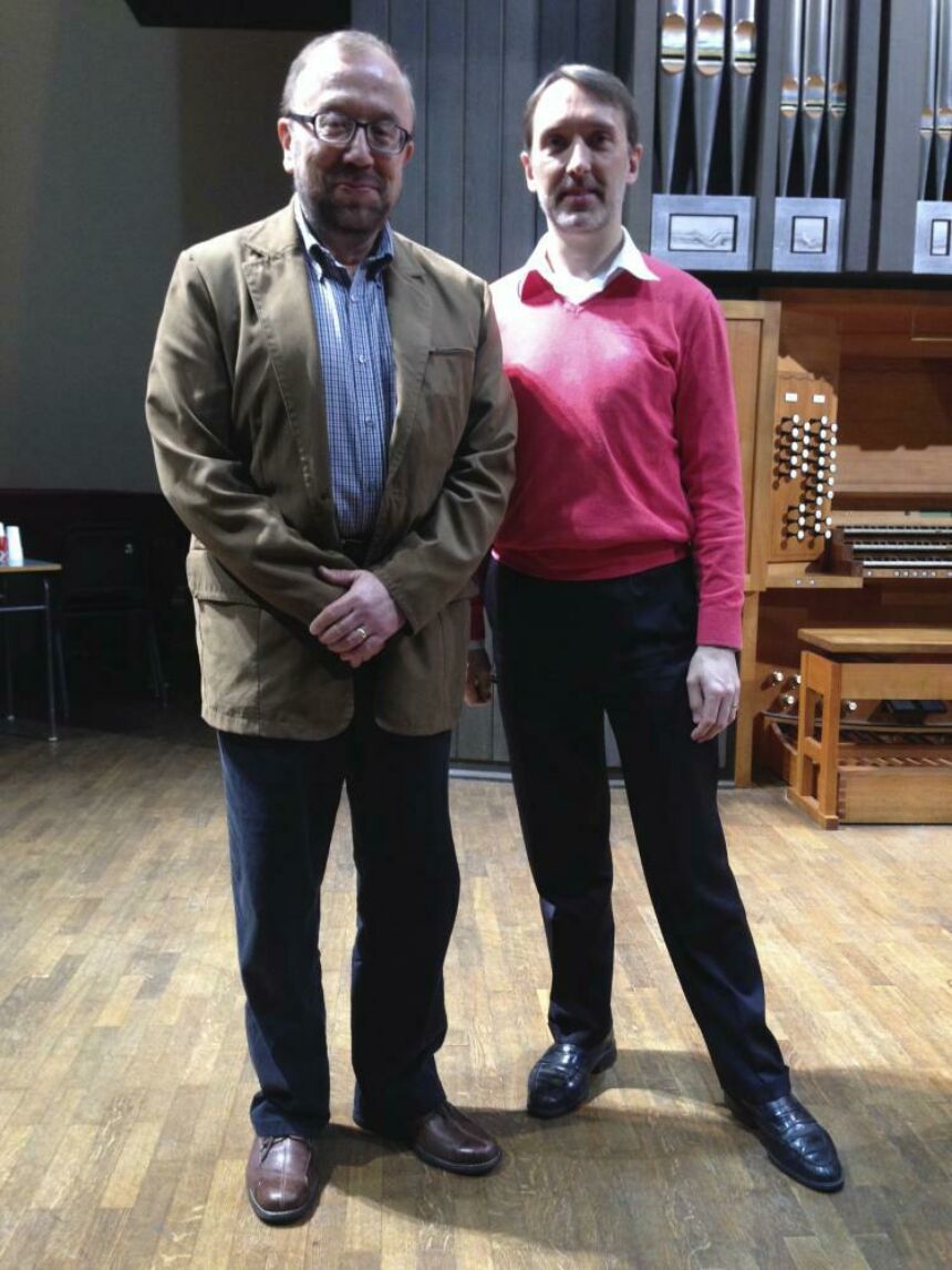 Photo of Vincent Benitez standing with Olivier Latry in front of an organ.