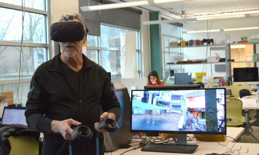 Photo of a Stuckeman faculty member demonstrating augmented reality equipment in one of Stuckeman's workshops.